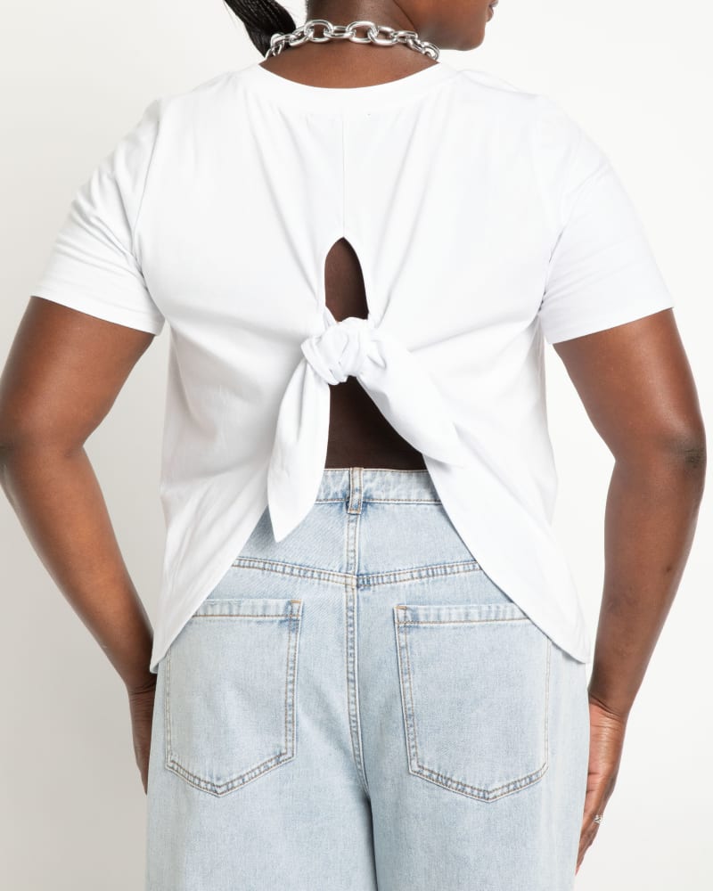 Back of a model wearing a size 26|28 Tie Back Tee in White by ELOQUII. | dia_product_style_image_id:294204